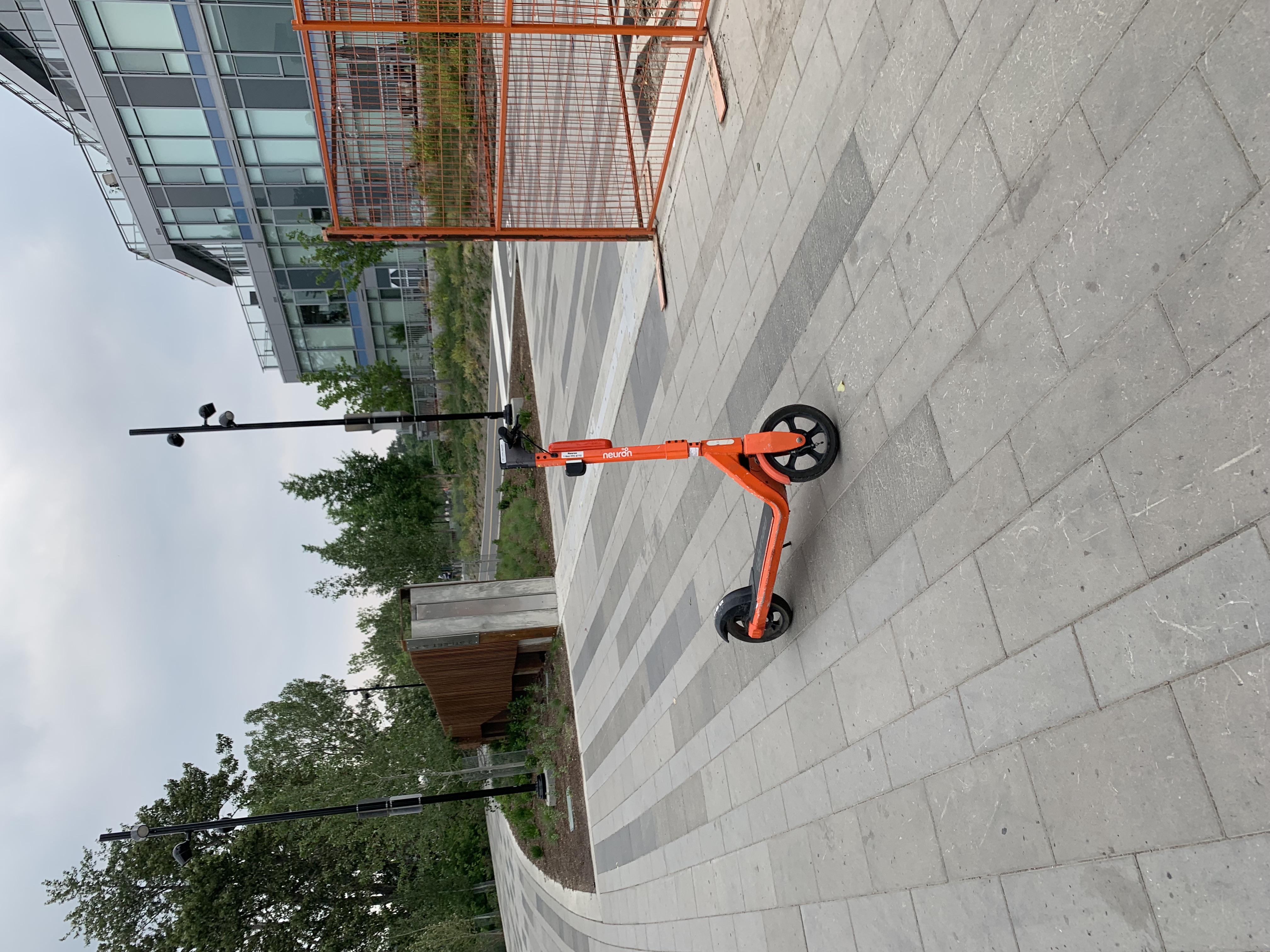An orange electric scooter.